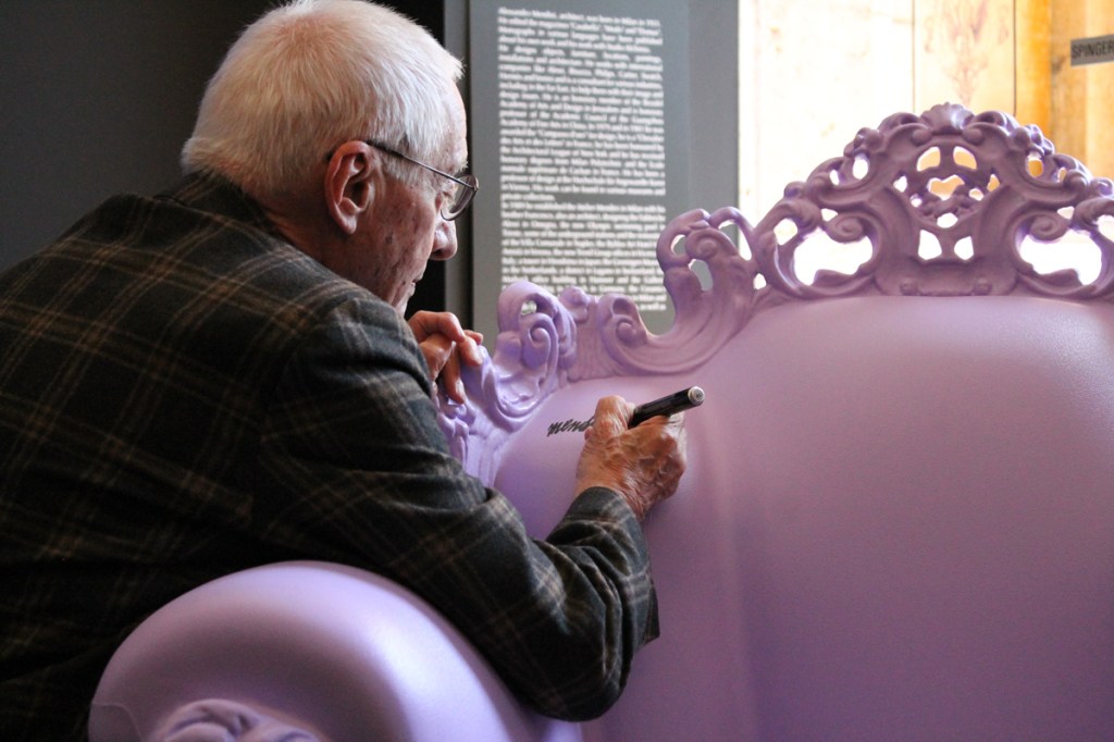 Alessandro Mendini signs the special edition "violato" Magis Proust armchair on May 10, at the opening of the 2015 D’Annunzio e i Giardini di Pan, that is taking place the Brescia province of Italy until Oct. 31. 