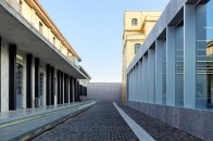 A view of the forecourt and understated museum entrance at OMA's Fondazione Prada, in Milan.