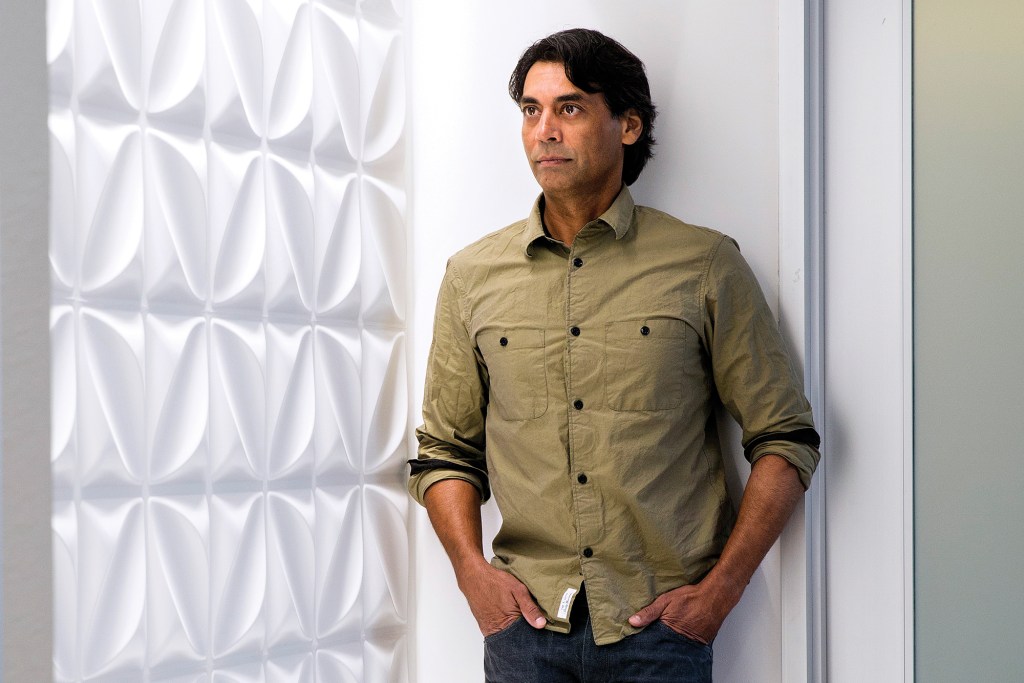 Ketra CEO Nav Sooch at the company’s Austin, Texas, headquarters next to a display that showcases the full spectrum of rich saturated colors and plush pastels that the company’s lighting technology can produce.&nbsp;