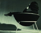 Lina Bo Bardi lounging in her iconic Bowl Chair.