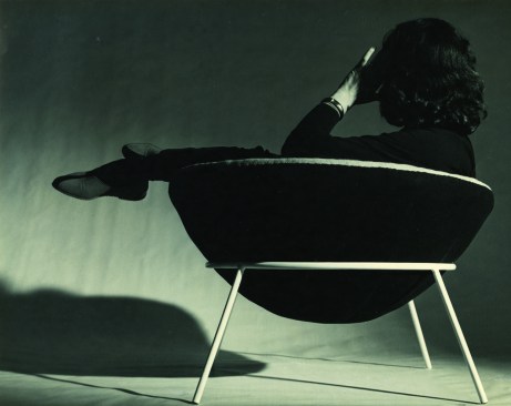 Lina Bo Bardi lounging in her iconic Bowl Chair.