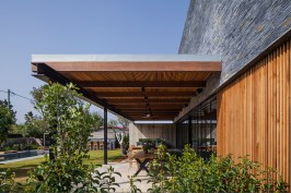 Front porch, with outdoor seating and eating areas.