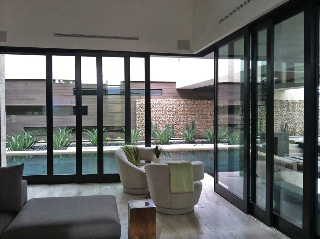 90° Corner Pocketing Multi-Slide doors open from the corner and slide into the wall to transition between indoor and outdoor living spaces. The doors use aluminum-clad or wood exteriors and all wood interiors, with various finish options available. www.sierrapacificwindows.com. Circle No. 41.