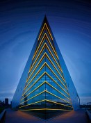 The river side building prow is marked by gold LED lights emphasizing form inspired by a rowing shell.  The concrete platform is within 10’ of the river’s edge.