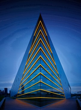 The river side building prow is marked by gold LED lights emphasizing form inspired by a rowing shell.  The concrete platform is within 10’ of the river’s edge.