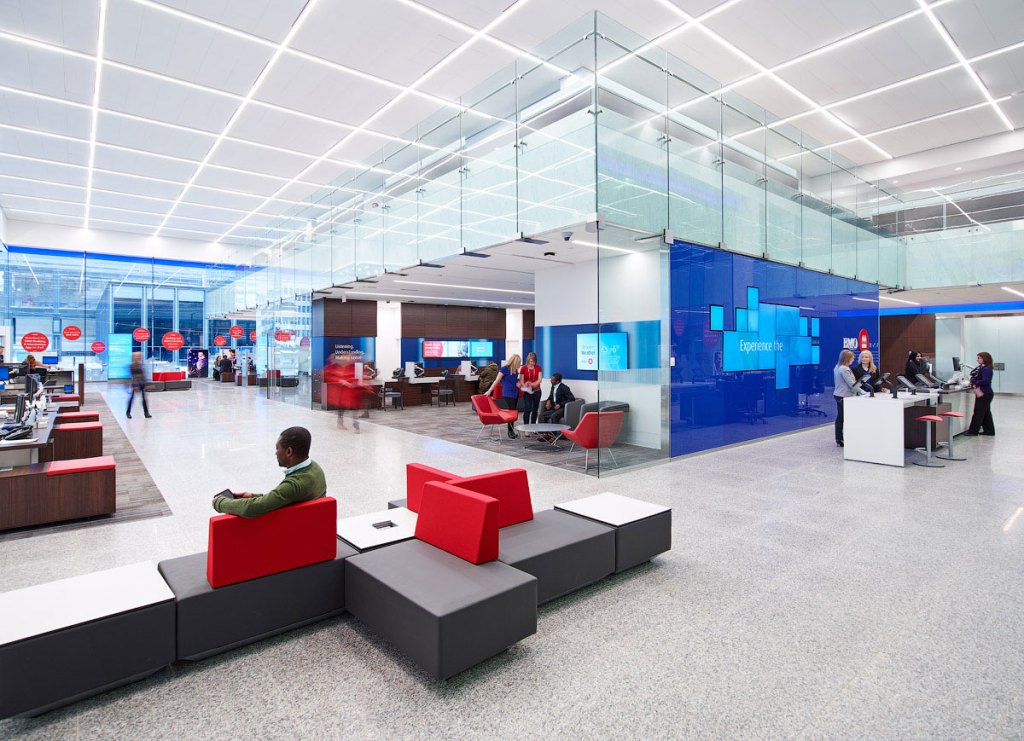 3500K was selected as the color temperature for all the fixtures to support the bank's blue corporate color scheme and the material palette that includes warm wood tones.