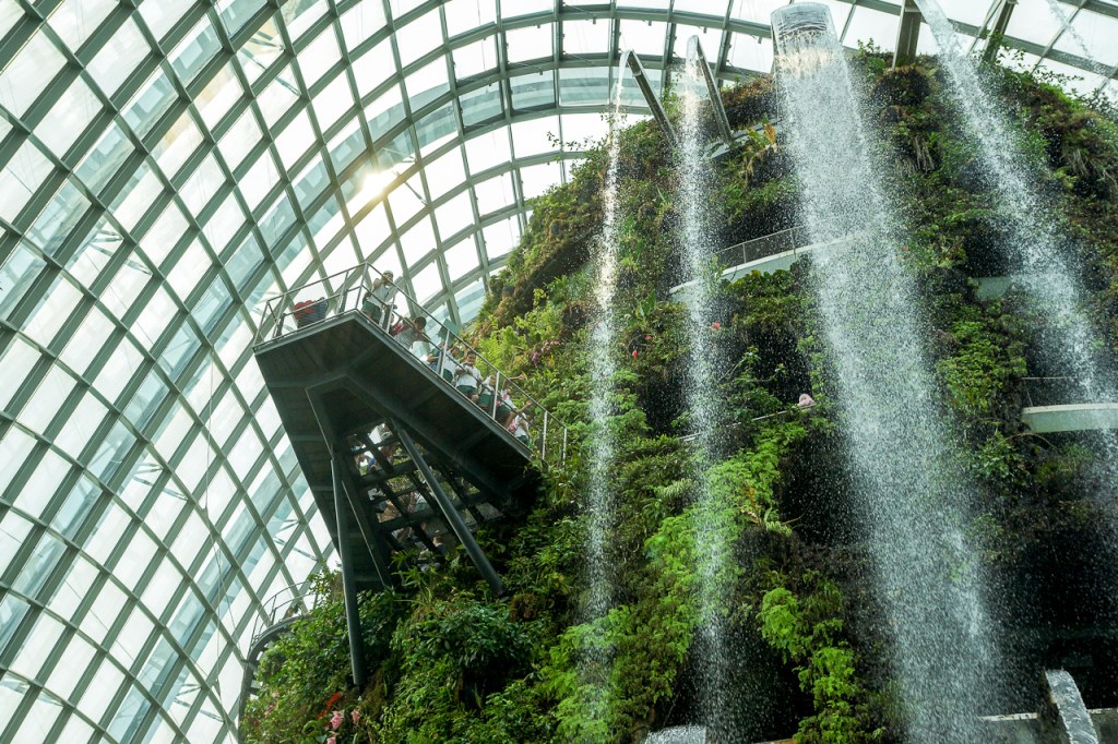 A waterfall inside one of two climate-controlled conservatories at Singapore's Gardens by the Bay park provides mist to maintain a cool, moist environment.
