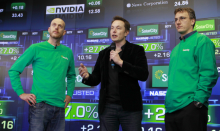 Founder & COO Peter Rive, Chairman Elon Musk , SolarCity Founder & CEO Lyndon Rive speak at the company’s IPO at the NASDAQ stock exchange on December 13, 2012 in Manhattan, New York. SolarCity is a leader of distributed clean energy and will trade under SCTY. (Mark Von Holden/AP Images for SolarCity)