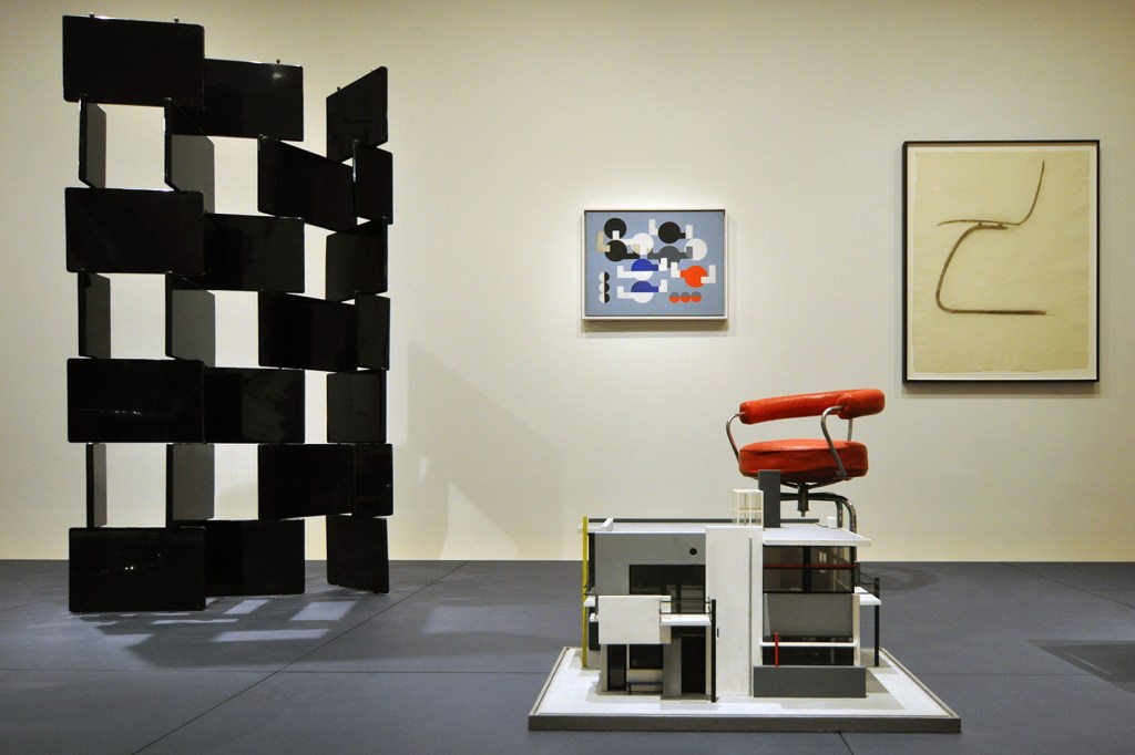 MoMA's "Designing Modern Women 1890-1990" was exhibited in the Architecture and Design Galleries in 2014. Left to right: Screen, by Eileen Gray; Schröder House model, by Gerrit Rietveld with Mrs. Truus Schröder-Schräder; Composition of Circles and Overlapping Angles, by Sophie Taeuber-Arp; Revolving Armchair, 1928, by Charlotte Perriand; Side Chair, by Alvar and Aino Aalto.