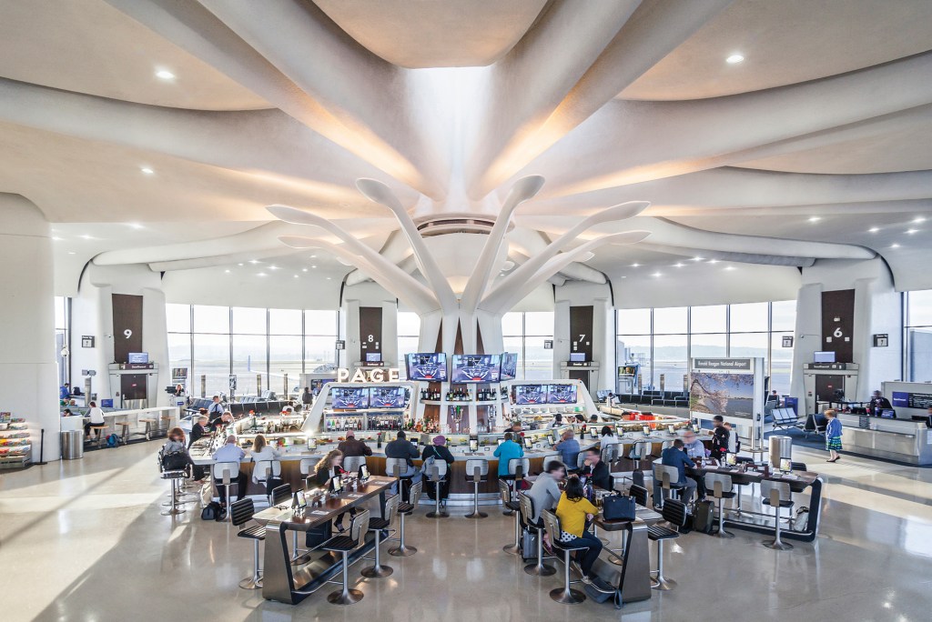 A view of the terminal at midday when the color temperature of the petal fixtures transitions to 4000K to balance the abundance of natural light.