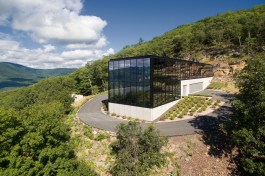 The circular driveway at the Shokan House goes through the residence, thanks to wide-span garage doors on either side of the ground floor of the structure.