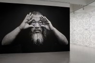 Portrait of the artist at the entrance of "Ai Weiwei: Trace at Hirshhorn"