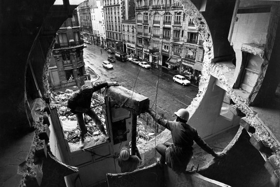 Gordon Matta-Clark and Gerry Hovagimyan working on Conical Intersect, 1975