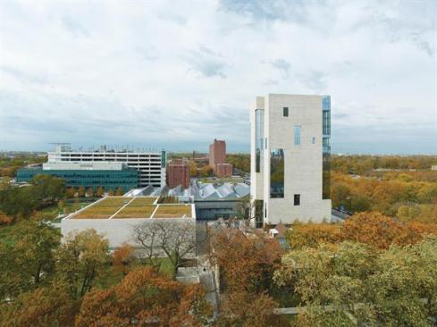 The+Logan+Center+comprises+a+tower+and+two+wings+(capped+in+saw-toothed+and+green+roofs%2c+respectively).+The+fa%c3%a7ades+are+clad+not+in+the+traditional+Indiana+limestone+of+other+university+buildings%2c+but+in+a+warmer-toned+version+that+is+quarried+in+Missouri.