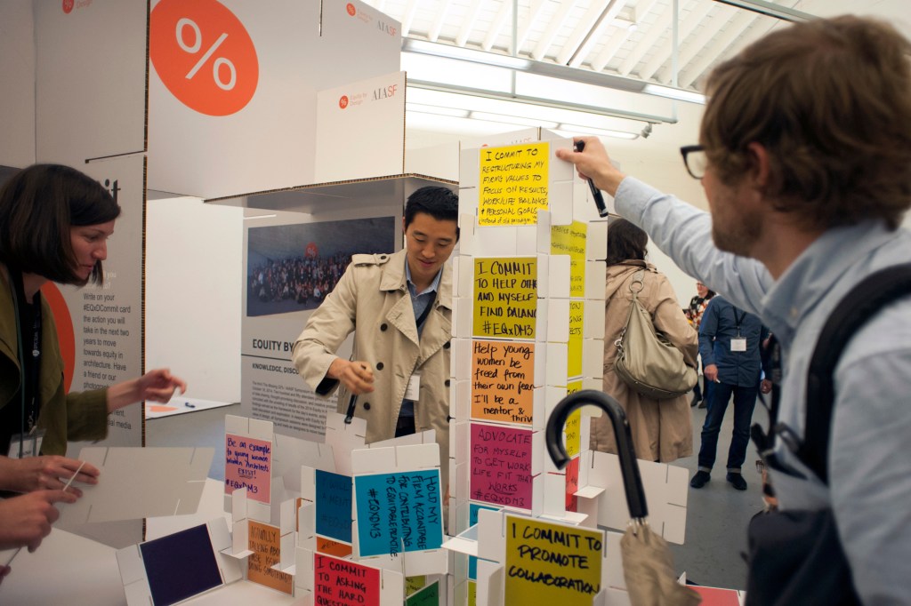 Attendees of AIA San Francisco's 2016 Equity by Design symposium compile action items to promote equity in the architecture profession into an Eames-inspired house of cards.