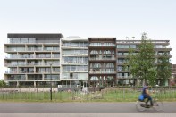 The three neighboring buildings were part of the same city-run program, but the brick-faced Amstelloft ended up most closely following the baugruppe model.