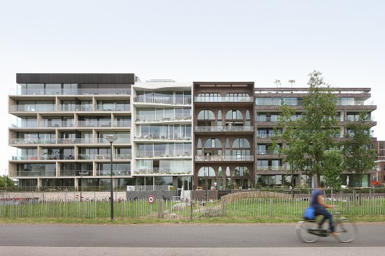 The three neighboring buildings were part of the same city-run program, but the brick-faced Amstelloft ended up most closely following the baugruppe model.