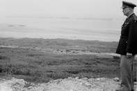 Gen. Dwight Eisenhower stands on the cliff overlooking Omaha Beach on the Normandy coast in France as he makes an anniversary visit to the scene of the 1945 D-Day landing of the Allied troops, June 9, 1951. (AP Photo)