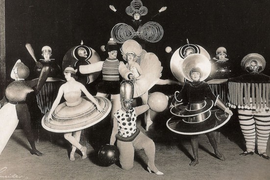 A group of performers from a Triadisches ballet by Oskar Schlemmer, produced during his time with the Bauhaus (1927)