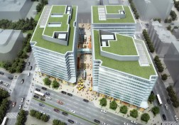 Aerial View from the North showing three towers and green roof terraces.