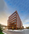 T3 is made chiefly with nail-laminated timber (NLT). Over 1,100 8-foot wide by up to 40-foot long NLT panels were used for exposed structural ceiling and roof panels with concrete topping.