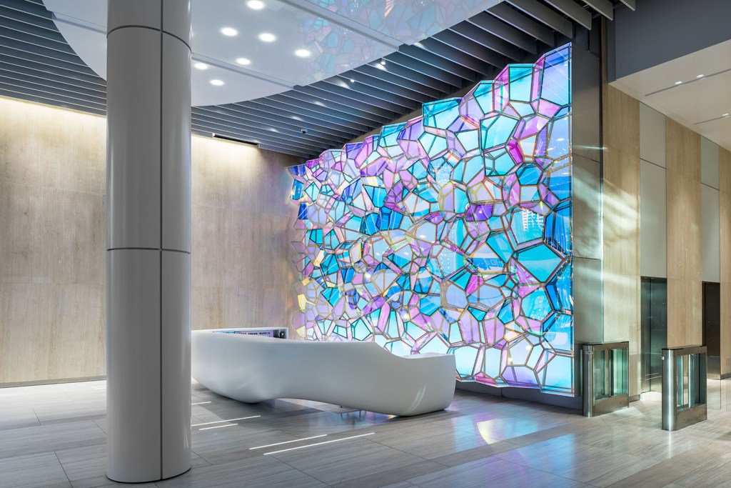 The dichroic film on the panels creates different color reflections.