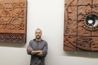Keith Van de Riet with the students' terra-cotta models.