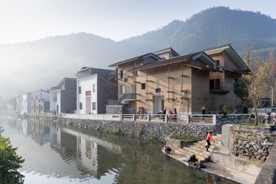 View southeast along the stream that runs through Wencun, showing new residences 