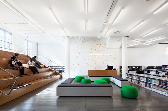 L-bracket lounge with bleacher, stacks and constellation graphic. The field of crosses maps the star constellation Leo - a coded reference to NYPL's ubiquitous lion mascot.