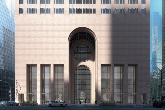 The updated renderings show clear glazing and a refreshed central arch.