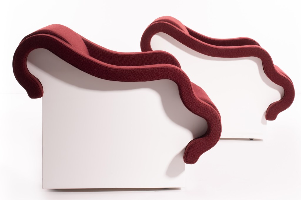 Ettore Sottsass designed the Poupouf armchairs—made of white lacquered wood, foam, and burgundy fabric—for Poltronova in 1970.  This piece is estimated to sell for €8,000 to €12,000 ($9,233 to $13,850).