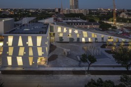 Aerial view from west at night, showing roof terrace