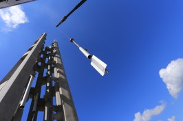 A chime is lifted by crane into the Tower of Voices