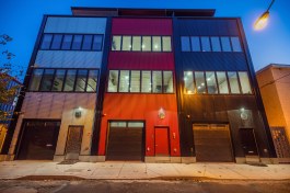 Exterior View at Night, Corrugated Galvalume-Coated Steel Siding, Reinforced Concrete Party Walls & Floors