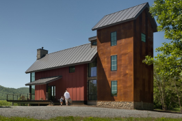 The home is designed to resemble a barn and silo