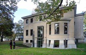 The new double-height glass entrance and canopy is gracious without competing with the historic architecture