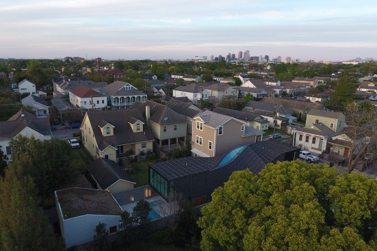 Aerial view of neighborhood from the northeast, showing the J-House at center right.