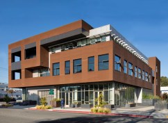 Wrapping form and material with ground floor commercial interfacing plaza