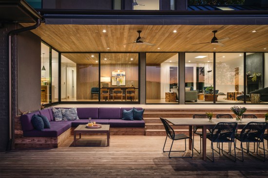 View of Outdoor Living Deck and Interiors at Dusk