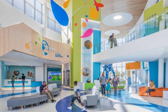 Life Center, floor pattern seamlessly flows from interior to exterior landscape while simulating a winding creek through the center’s villages.  