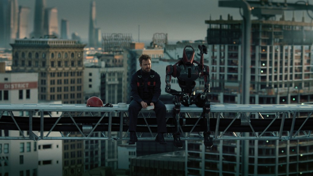 Caleb (Aaron Paul) and his construction sidekick