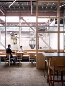 Windows in the restaurant offer views into the skylit fermentation hall and brew house.