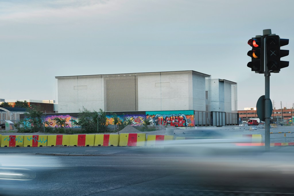 The new substation has site-poured concrete walls with a Codina Architectural stainless steel mesh overlay.