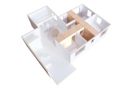 The Storage “T,” an apartment renovation in Hong Kong, combines all of the closet and storage spaces into one T-shaped unit that serves as the defining element of the layout.