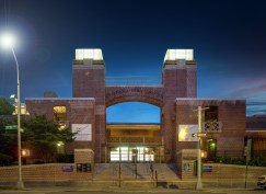 At night, the glass lanterns are illuminated from within the building, beckoning neighborhood residents and park guests.