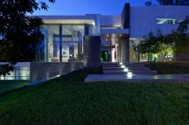Glass fronted exterior of luxury modern Beverly Hills home.