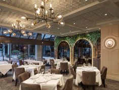 To create “old world charm with a modern vibe,” the Italian Kitchen restaurant uses Ceilume ceiling panels that evoke timeless decorative motifs.