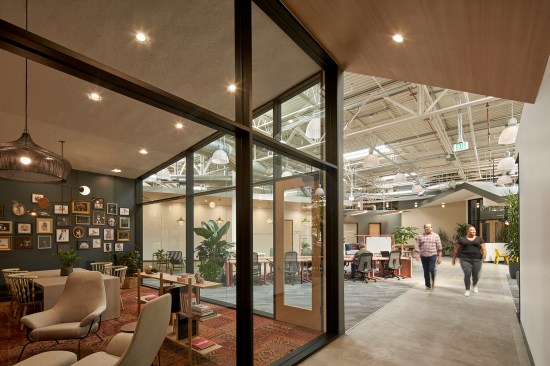 The library, a central featured space for quiet reflection and small group collaboration. bonus: custom furry family portraits adorn the walls.