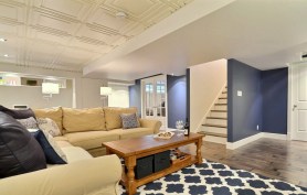 Designer Mélyssa Robert furnished the basement with a family room, office, bedroom, bathroom, wine cellar, laundry room, and storage closets, increasing the home's living space by 50%.