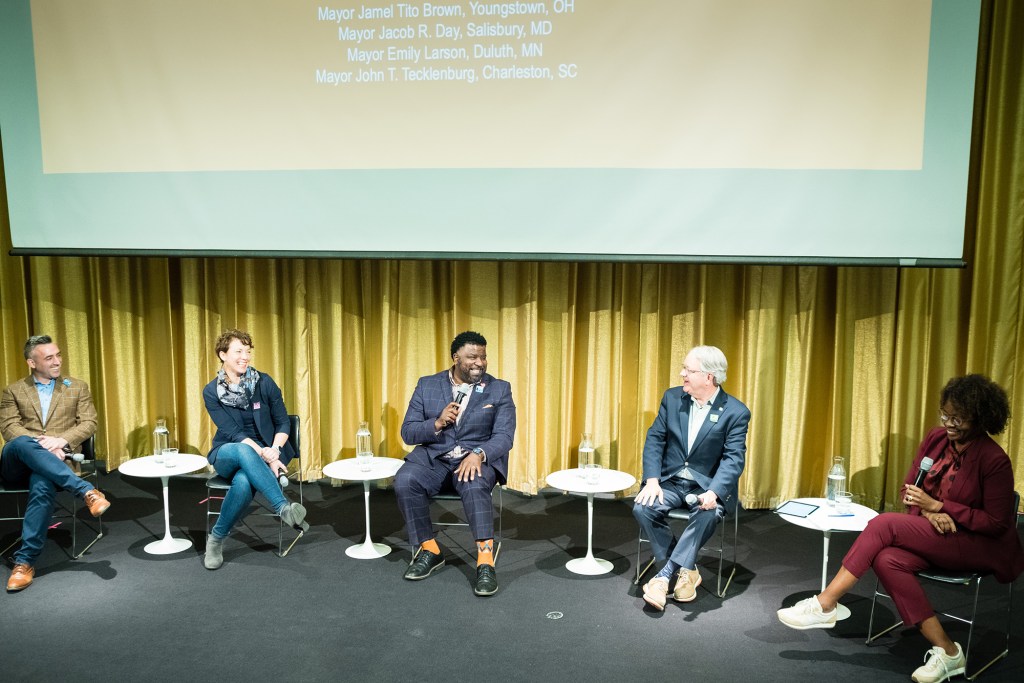 At the “Mayors Imagining the Just City” conference, organized by the Harvard Graduate School of Design’s Just City Lab and the Mayors’ Institute on City Design, a panel including (left to right) Mayors Jacob R. Day, Emily Larson, Jamael Tito Brown, and John J. Tecklenburg, and moderator Toni L. Griffin spoke on the topic of creating just cities, infrastructures, and community-building.